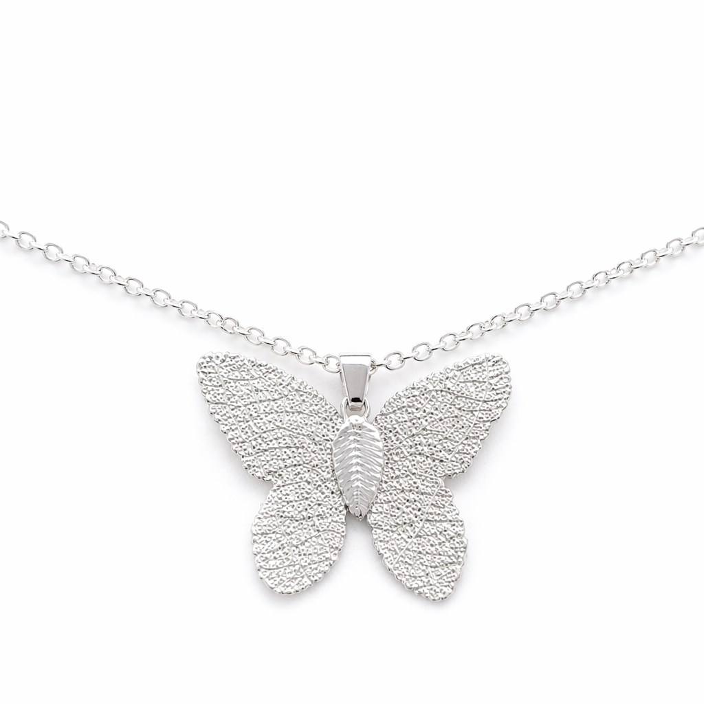 Silver butterfly pendant on a chain against a white background