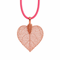 Necklace with a leaf-shaped pendant on a red cord against a white background