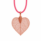 Necklace with a leaf-shaped pendant on a red cord against a white background