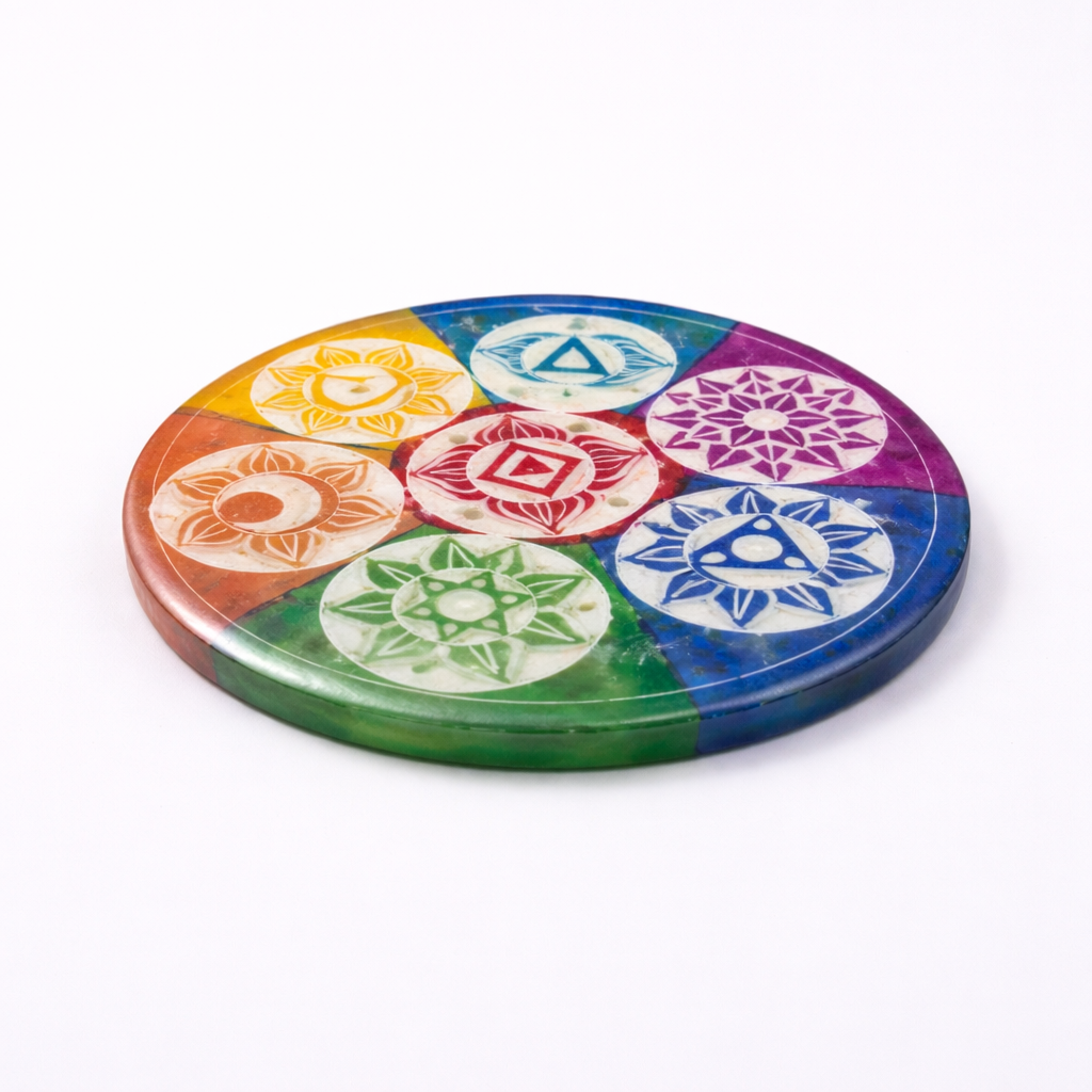 Colorful circular object with various symbols on a white background