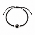 Black macrame bracelet with a central onyx bead on a white background