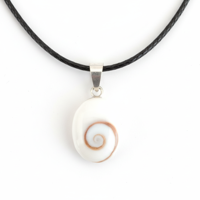 Necklace with a white shell pendant on a black cord against a white background
