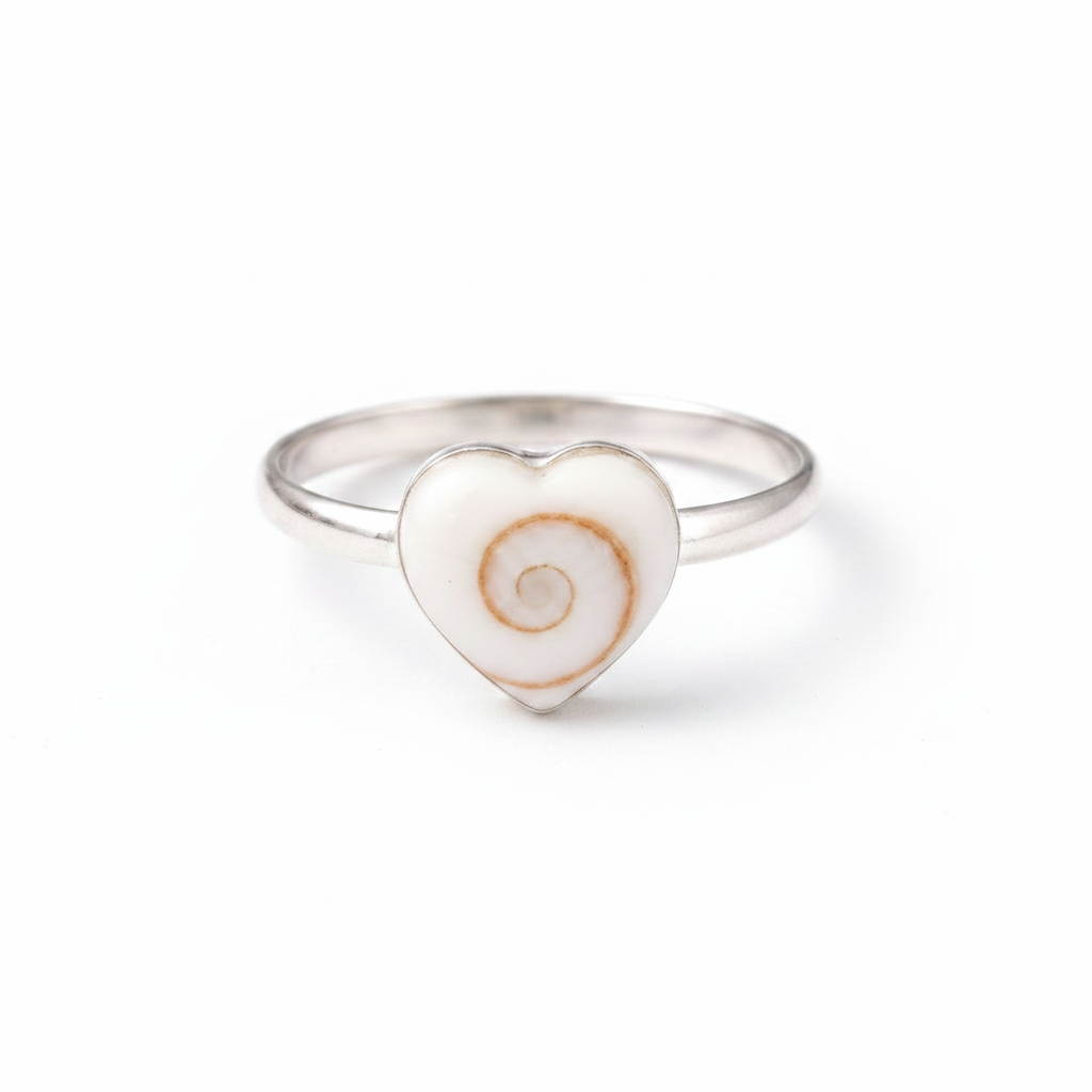 Heart-shaped ring with a spiral design on a white background