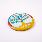 Colorful circular plate with a tree design on a white background