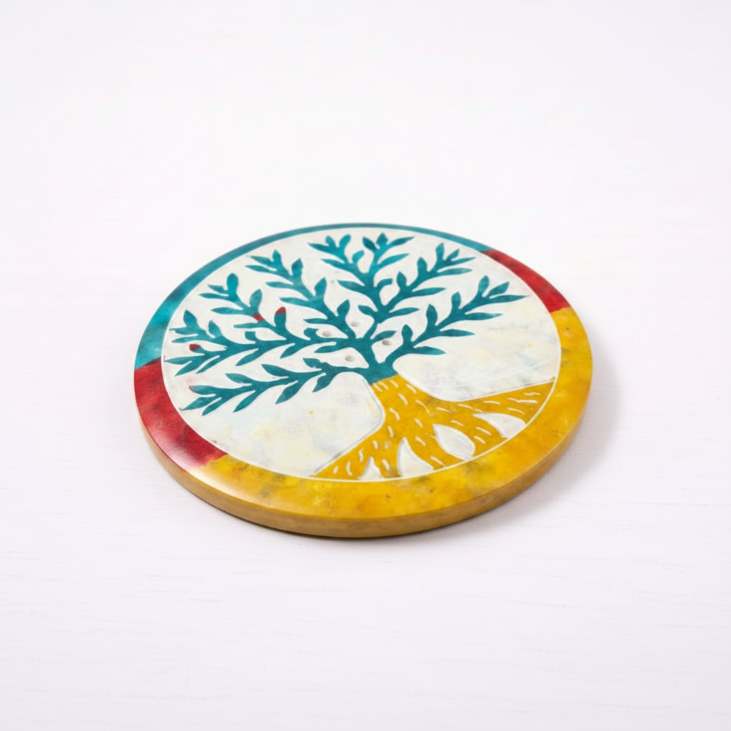 Colorful circular plate with a tree design on a white background